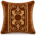 Front view of amber brown cushion cover with gold scroll embroidery.