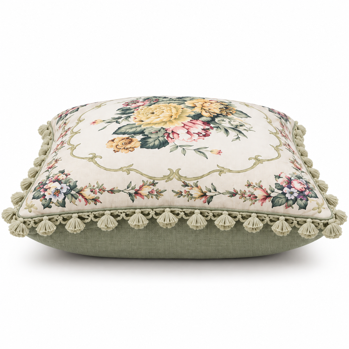 Front view of ivory floral cushion cover with yellow and pink flowers and tassel trim.