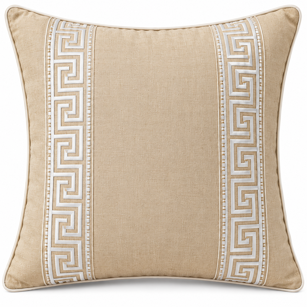 Front view of sand beige cushion with two ivory Greek key borders