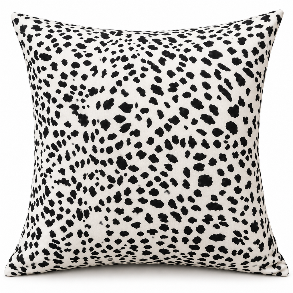 Front view of white cushion with irregular black spots