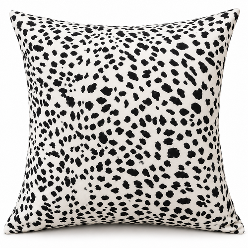 Front view of white cushion with irregular black spots
