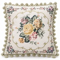 Low-angle view showing the floral front, piping and sage green backing.