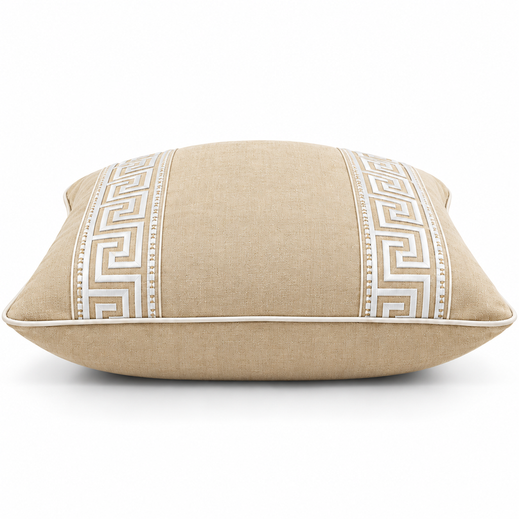 Side view of beige cushion with Greek key border design