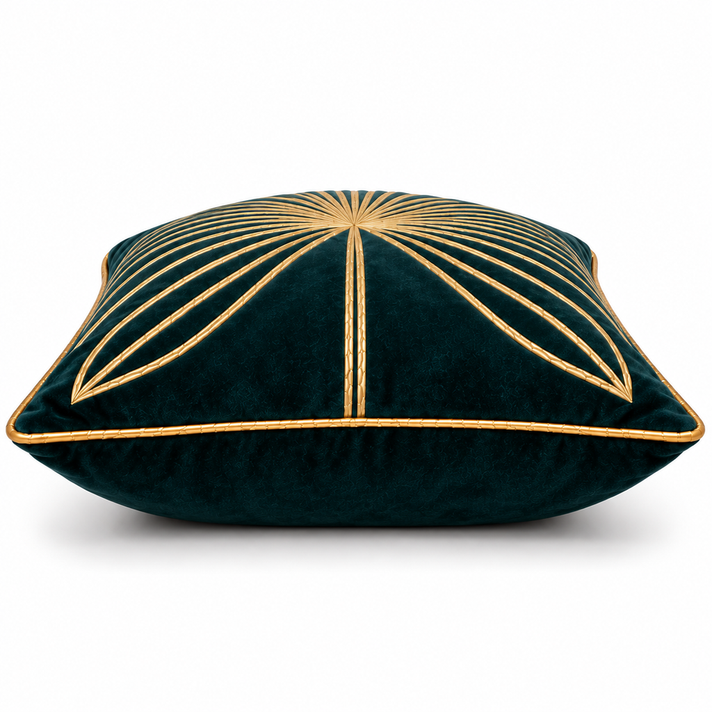 Side view of teal cushion showing the leaf motif and gold piped edge