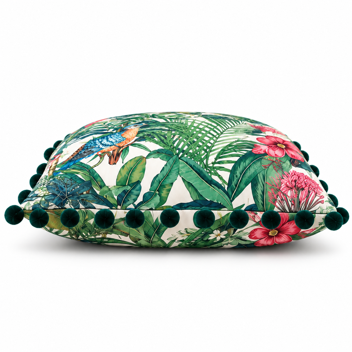 Side view of tropical cushion showing floral details and pom-pom edging