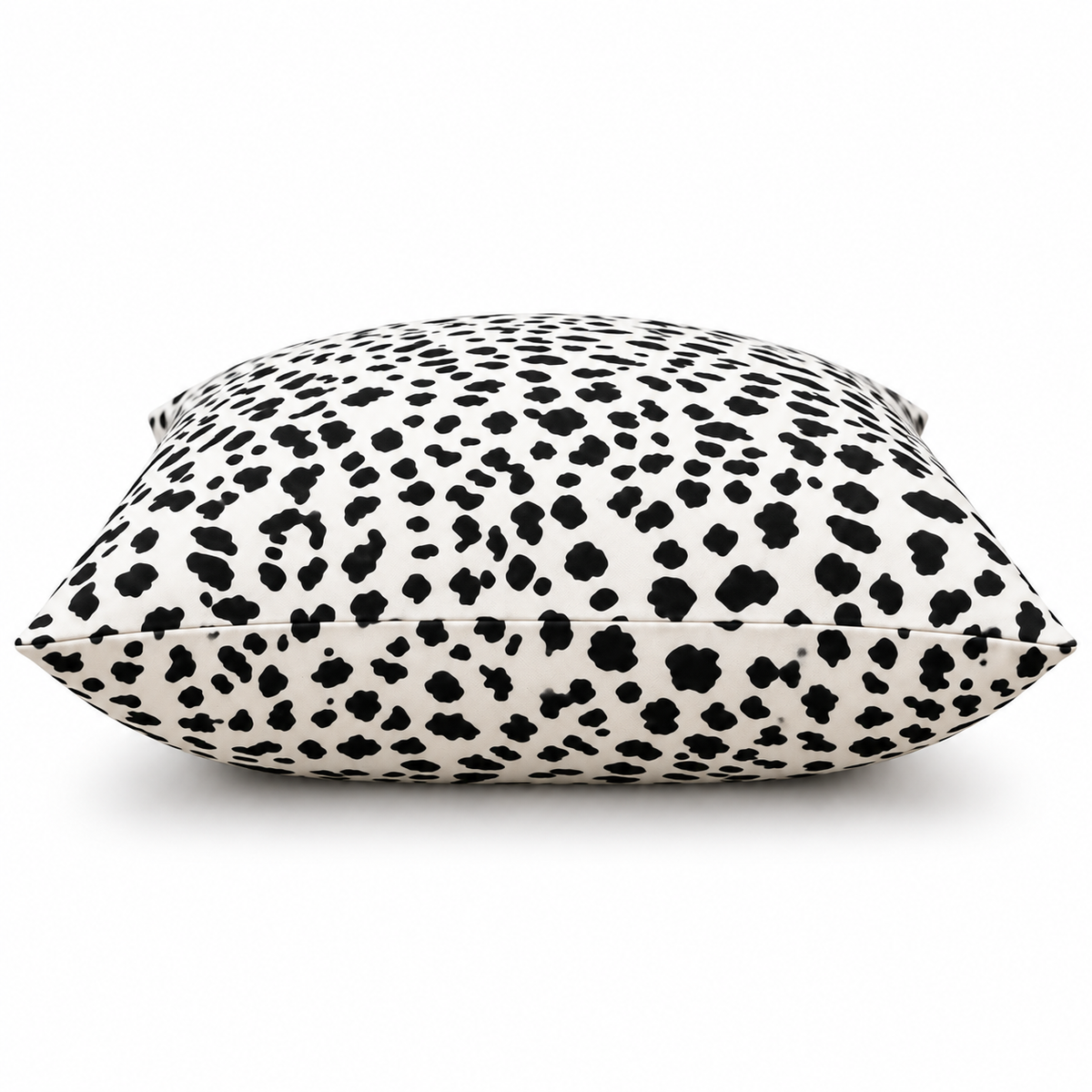 Side view showing the spotted pattern across the cushion
