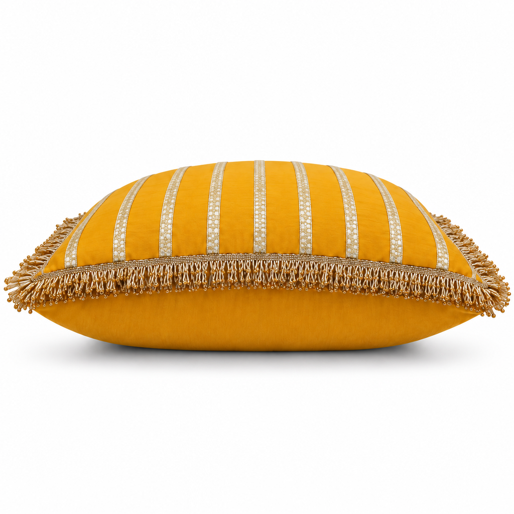 Side view showing cushion depth and gold fringe edging